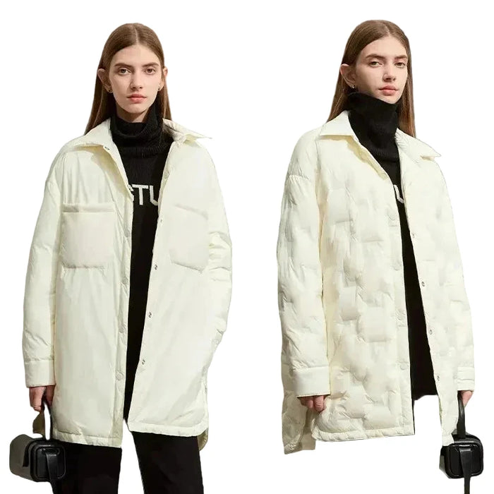 Two models wearing AMII off-white quilted puffer jackets over black turtlenecks, standing against a light beige studio background.